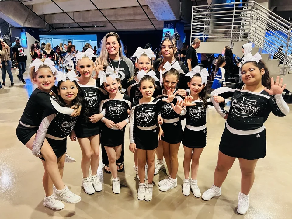 Category 5 athletes and coaches together after a competition performance